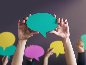 person holding speech bubble